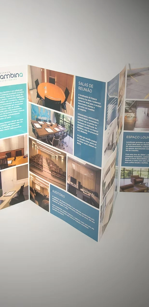 Espaço Bambina concertina brochure opened out, with photos of the meeting rooms and the auditorium.