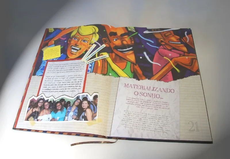 25th anniversary commemorative book open at a spread with colourful graffiti and the title Materialising the dream.
